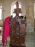 a figure preaching? Seated figures above